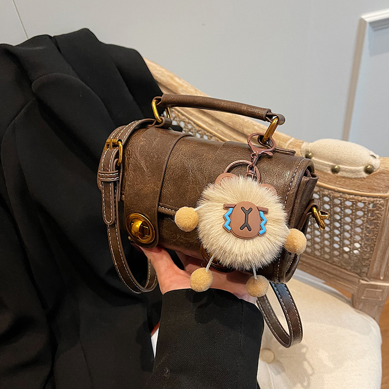 2025 Nuova borsa a tracolla alla moda da donna con lucchetto, borsa Boston portatile, borsa a cuscino French Niche_voghion.com