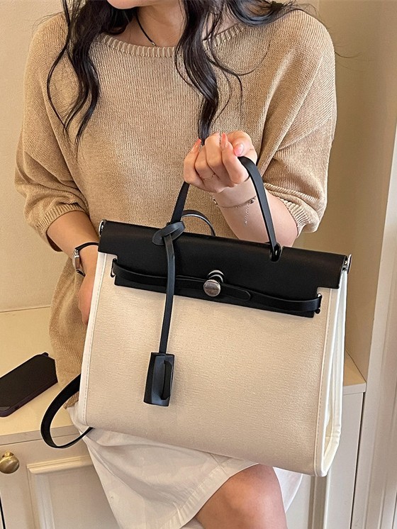 Nicho de moda portátil Kelly bolso mujer 2026 nuevo cross-border lienzo empalme color contraste viaje mochila de hombro