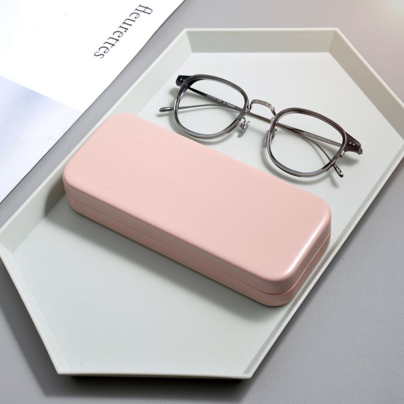 Caja de gafas simple para hombres y mujeres estilo retrógrado estilo portátil anti-presión viaje miopía gafas caja de cáscara