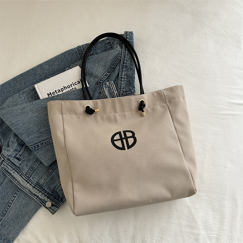 Bolsa de lienzo de gran capacidad de letras para mujeres este año nueva bolsa de hombro de moda universal bolsa de viaje bolsa de mano bolsa de mamá