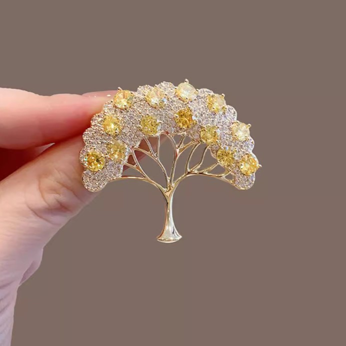 Golden elegant brooch
