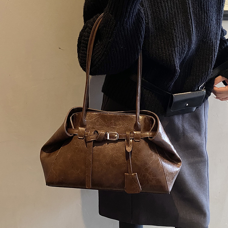 Alta textura retro gran capacidad hombro brazo bolso de mujer 2025 nuevo otoño invierno universal bolso de mano de viaje