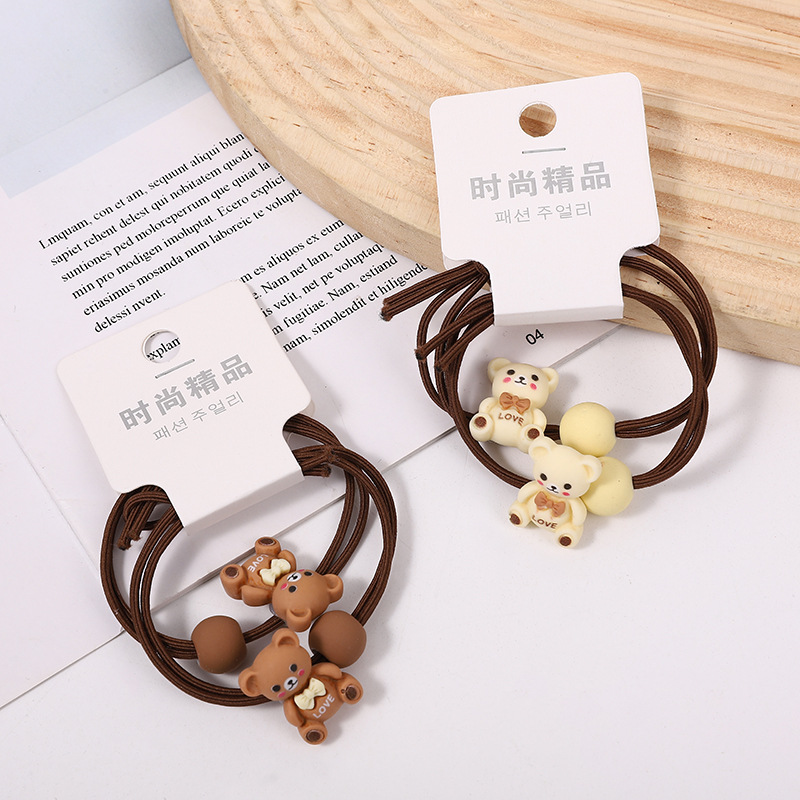 009 Ventas Directas Tarjeta de orden camuflaje A cuadros intestino grueso banda de pelo cuerda de pelo banda de goma tienda física dos yuanes tienda accesorios para el cabello accesorios para la cabeza