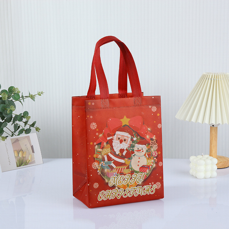Bolso de Navidad de punto transfronterizo, bolsa de embalaje de regalo, bolsa no tejida laminada en caliente plegable portátil personalizada