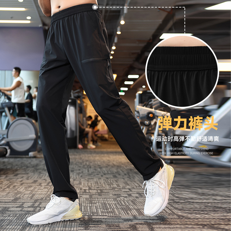 Pantalones deportivos elásticos de cuatro lados de nylon otoño de los hombres corriendo fitness casual Pantalones deportivos ligeros pantalones especiales americanos