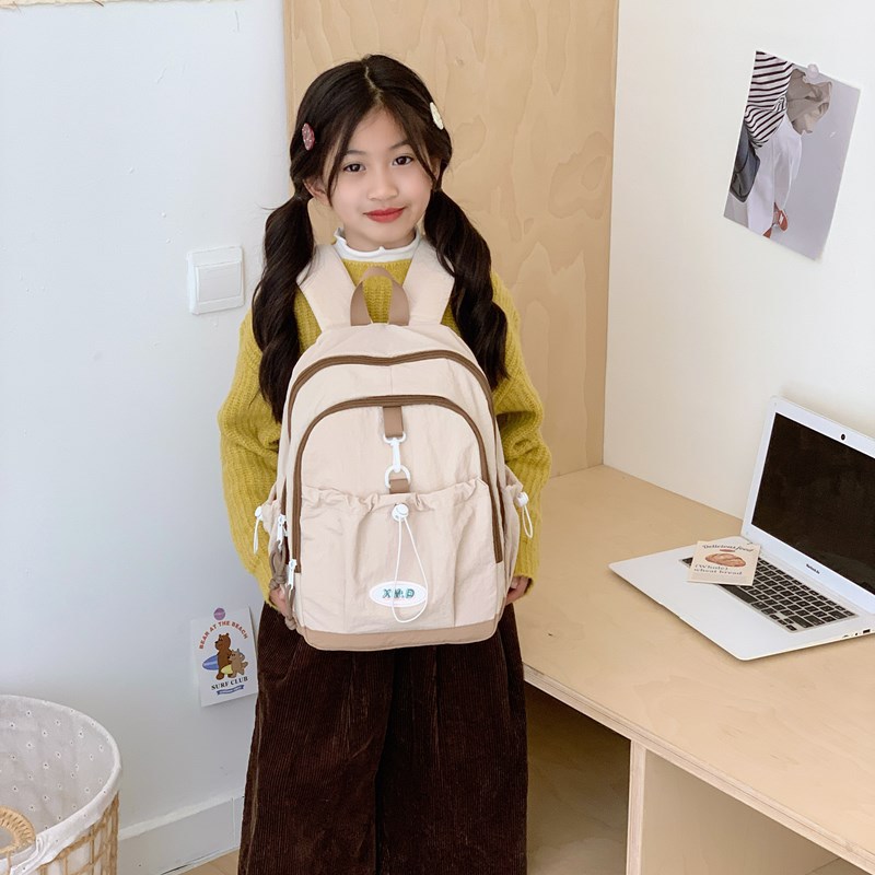 Coreana simple color sólido mochila de niños y niñas de gran capacidad mochila escolar 2026 nueva mochila de niños de cuerda