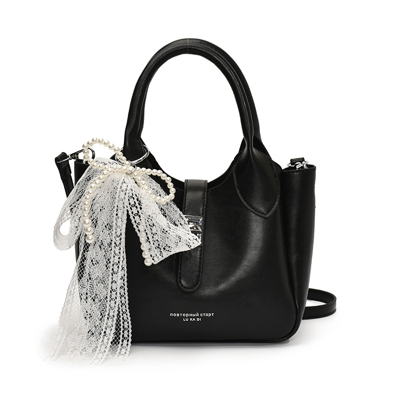 Coreano ultra caliente nicho bolso de cubo portátil para mujeres 2025 nuevo estilo de moda textura versátil alta sensación de hombro mochila