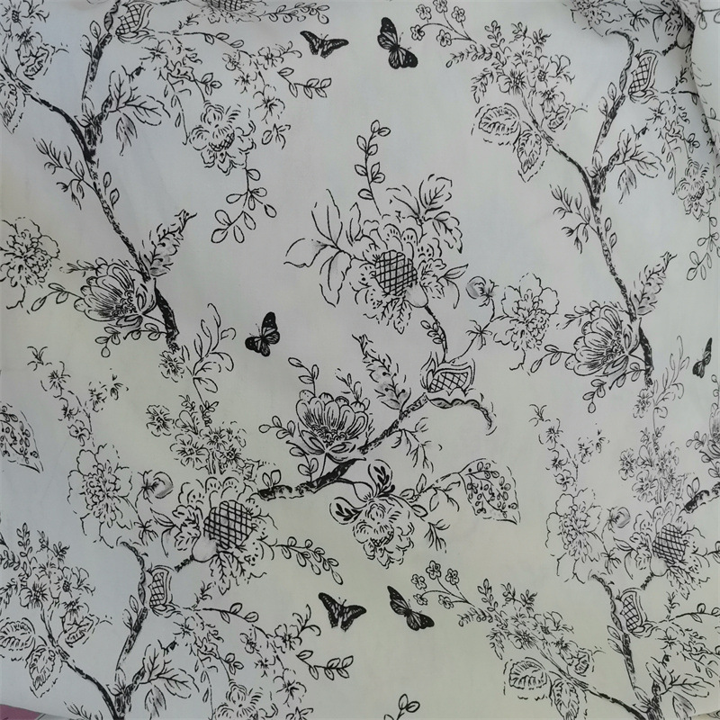 秋冬白底黑蝴蝶碎花全棉黑白印花布料棉袄旗袍裙服装纯棉面料批发