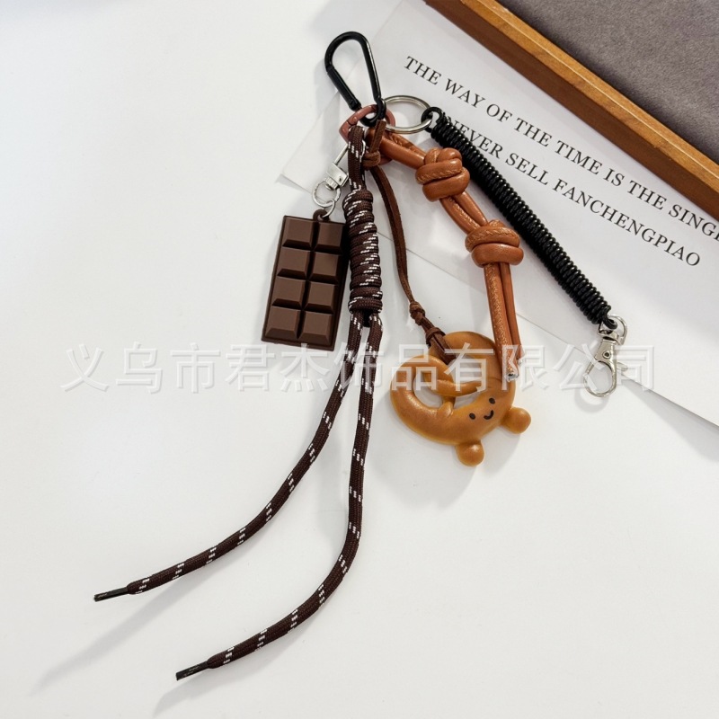 編みカバンのストラップの螺旋の結び紐のiuは鍵のボタンのネットの赤い色の結びの縄の装飾の部品を結びます。