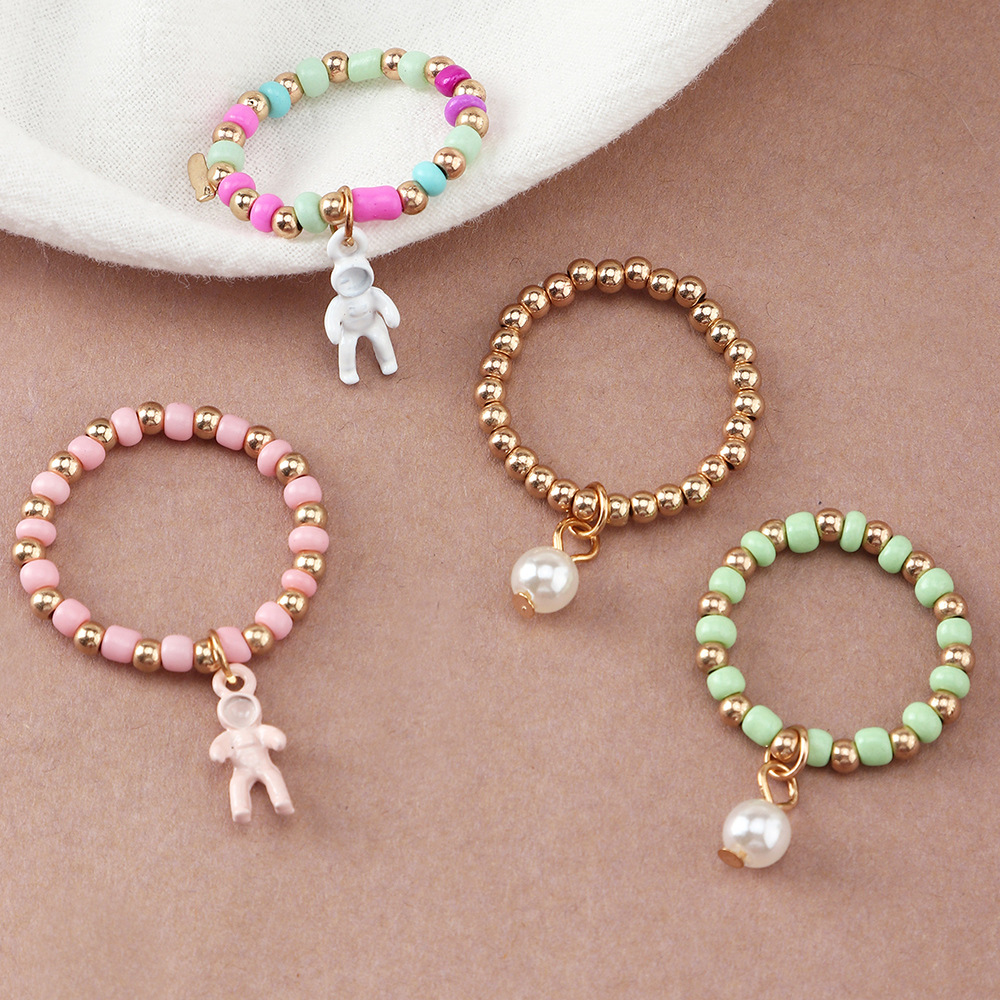 Simple Creative Spaceman Ring Color Rice Bead Elastic Tail Ring Set Ring display picture 5