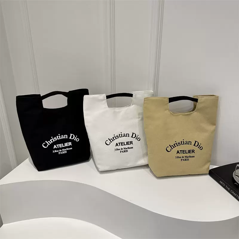 文艺手拎帆布包2024夏新款韩版休闲字母学生手提包潮流简约水桶包