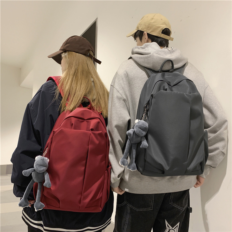 Mochila escolar para estudiantes universitarios simple en la moda mochila de gran capacidad coreana de color sólido mochila de viaje ligera y casual