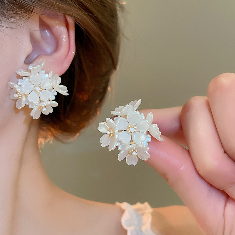 Pendientes de flor de lazo elegante de súper hada de plata Pendientes de moda de lujo ligero francés Pendientes de todo fósforo dulce de estilo literario
