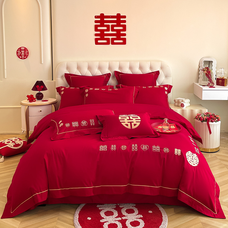 Una clase de madres y bebés de algodón de boda cuatro piezas grandes sábanas bordadas rojas chinas cubierta de cama de boda