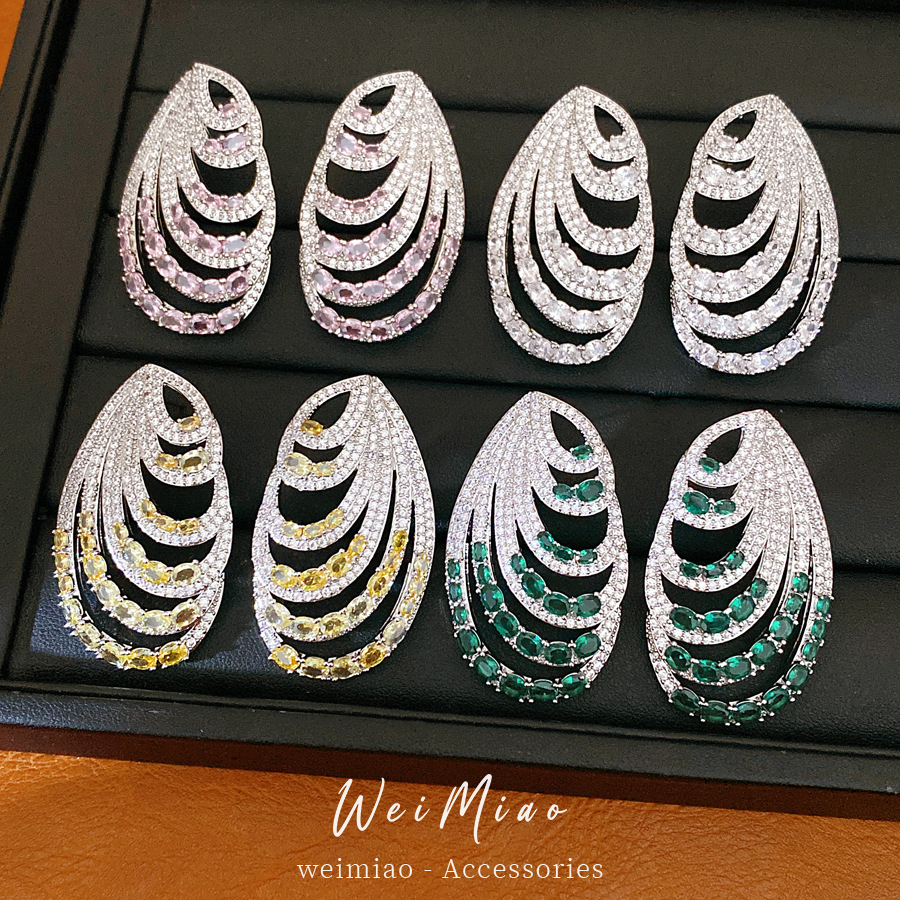 Aguja de plata zircon oval multicapa personalidad temperamento nicho pendientes de moda ligero lujo alta sensación auriculares al por mayor