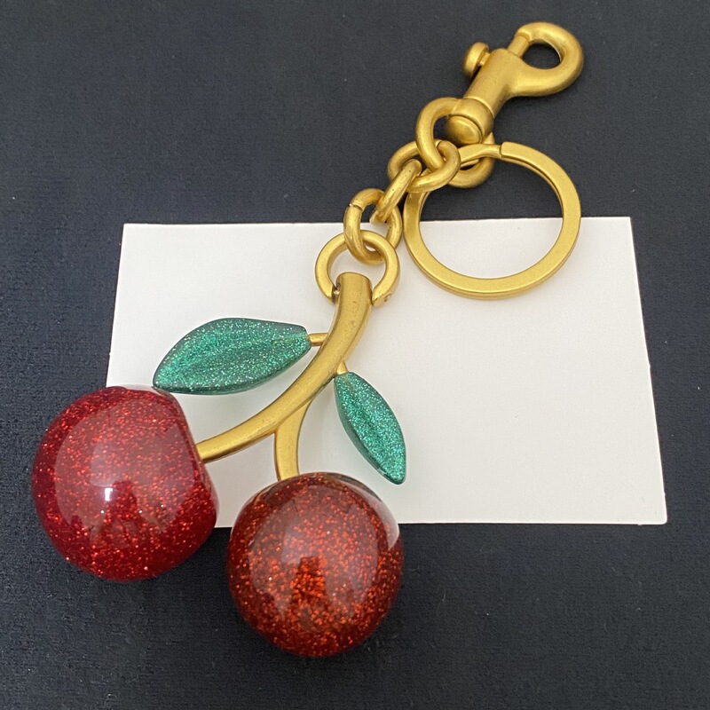 New stylish and simple commuter accessory, unique and exquisite cherry-shaped bag keychain, sweet metal pendant decoration New stylish and simple commuter accessory, unique and exquisite cherry-shaped bag keychain, sweet metal pendant decoration