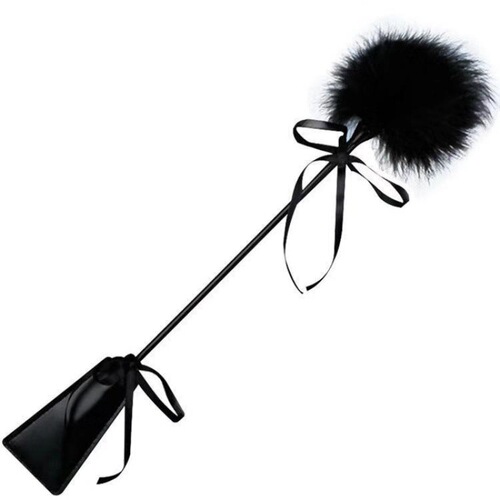 Flirty feathered paddle, handcrafted leather spanking toy for playful butt play—prelude to seduction, queenly teasing, and unconventional adult pleasure tools.