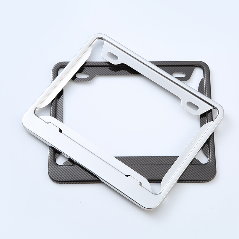 El fabricante suministra el marco estándar americano de la placa de matrícula de fibra de carbono de acero inoxidable cubierta protectora transfronteriza antirrobo multifuncional marco de la placa