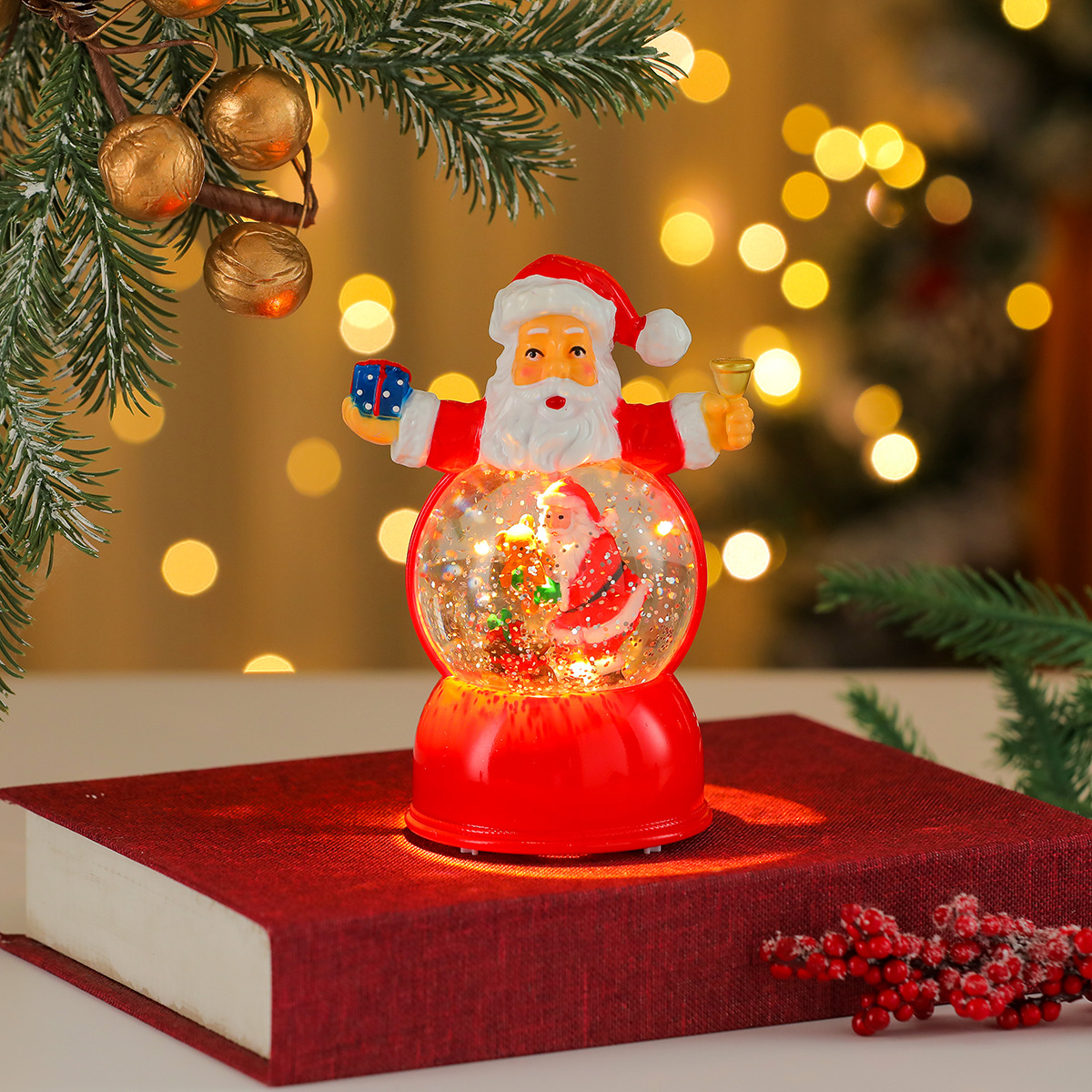 Una variedad de adornos de caja de música luminosa de resina giratoria de Navidad, adornos de tren giratorio, regalos de Navidad