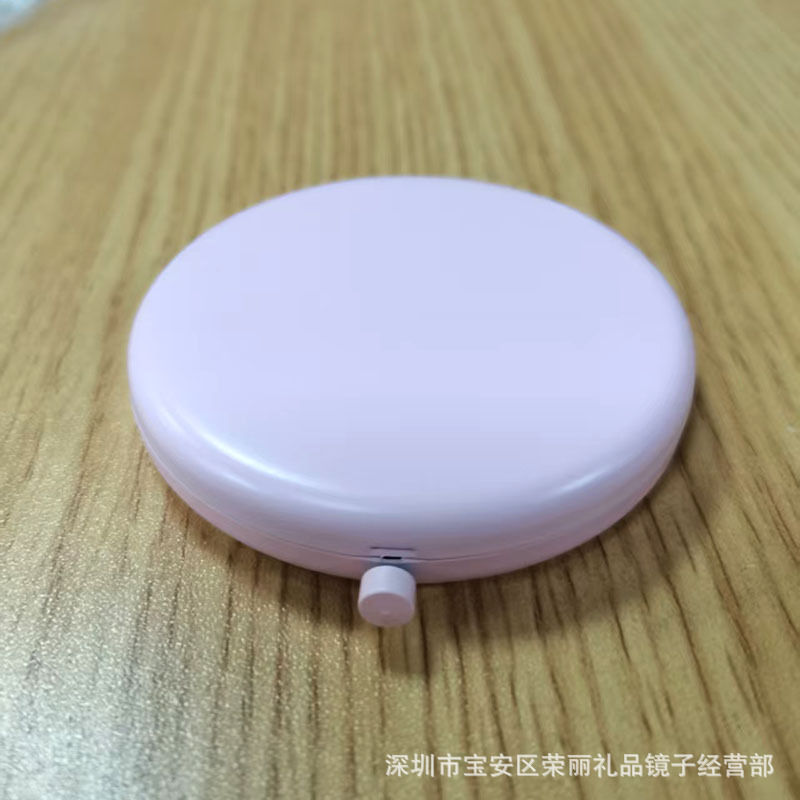 El espejo pequeño de doble luz plegable de metal de alta gama se puede grabar con el logotipo y el espejo de maquillaje portátil de mano al por mayor