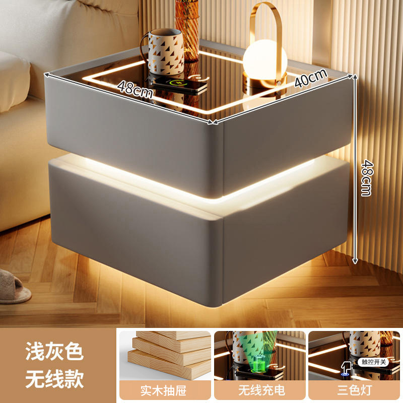 Mesa de cabezal de cama moderna lujosa inteligente con luces de alto nivel de sensación de dormitorio estante de cabezal de cama de viento de crema almacenar gabinete bajo junto a la cama