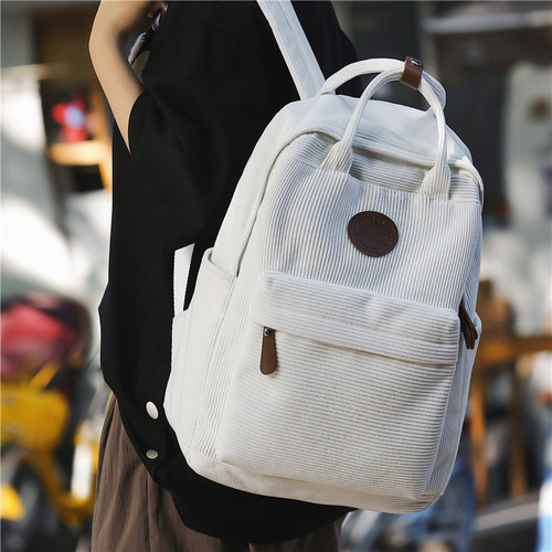 Denim canvas double shoulder bag, vintage style, suitable for students and leisure use.