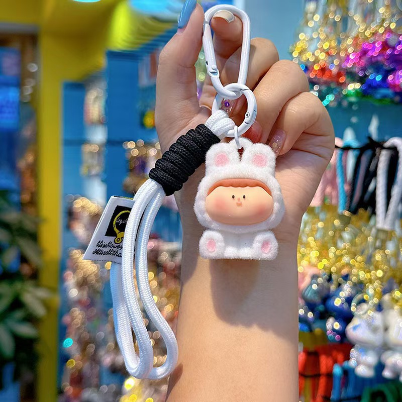 Caricatura floc amarelis llavero de automóvil pareja colgante bolsos creativos colgar garra máquina regalos al por mayor