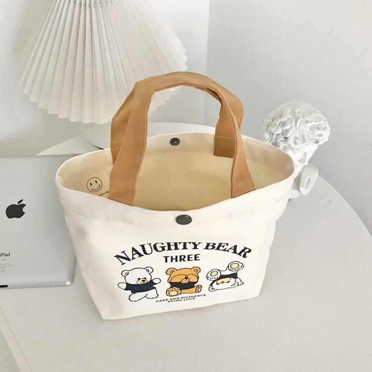 新商品の熊のキャンバスバッグの女子学生は携帯して出勤します。|undefined