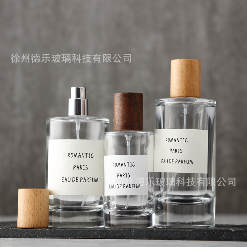Botella de perfume de tapa de madera al por mayor botella de perfume cilíndrica transparente simple sub-botella 50ml 80ml 100mL botella de perfume