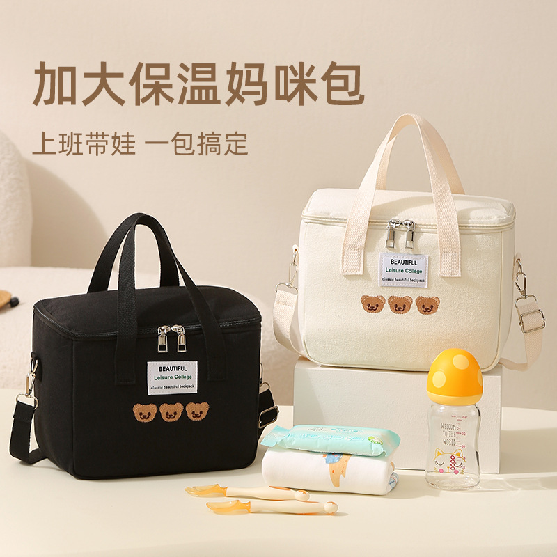 跨境帆布母婴包便携式涤纶刺绣斜挎手提包大容量批发带娃妈咪包