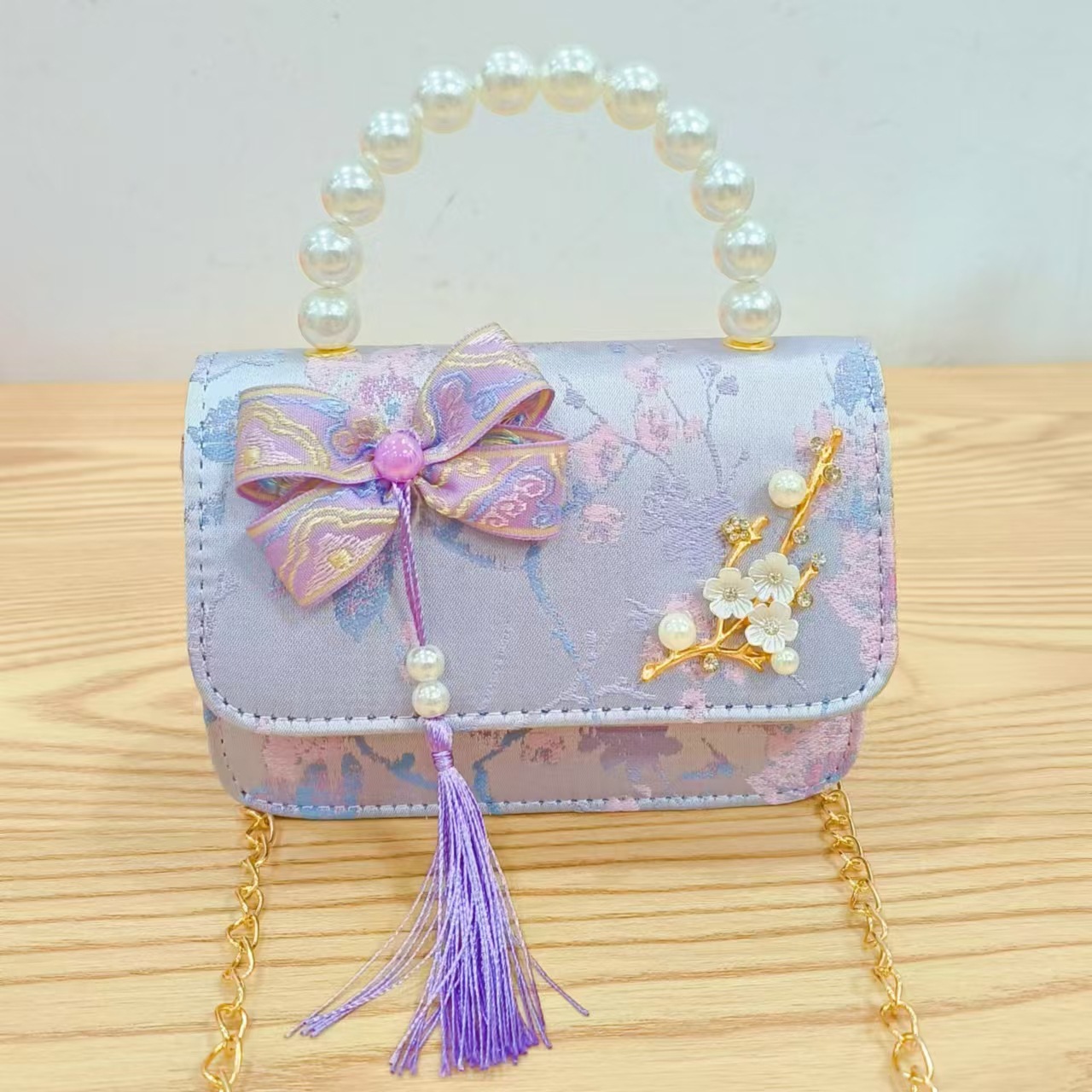 Bolsas de niños arco de estilo chino borda de niña pequeña princesa perla bolsa de cambio de mano al por mayor