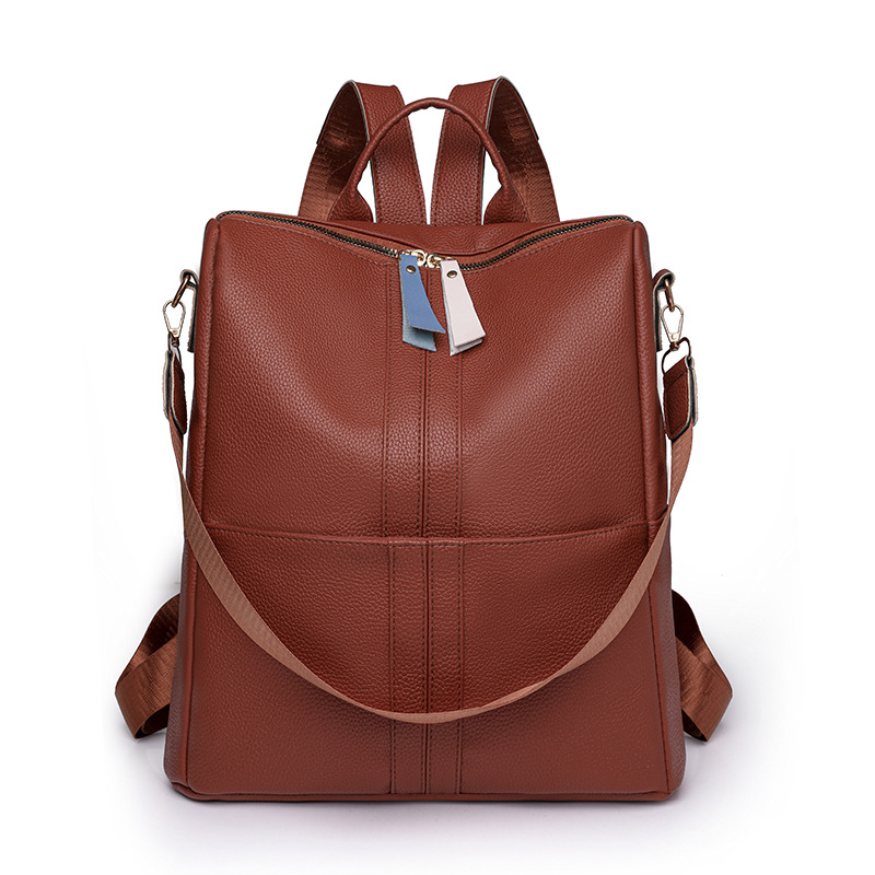 Spot al por mayor 2023 nueva mochila de cuero suave para mujer casual simple y versátil mochila de viaje de gran capacidad