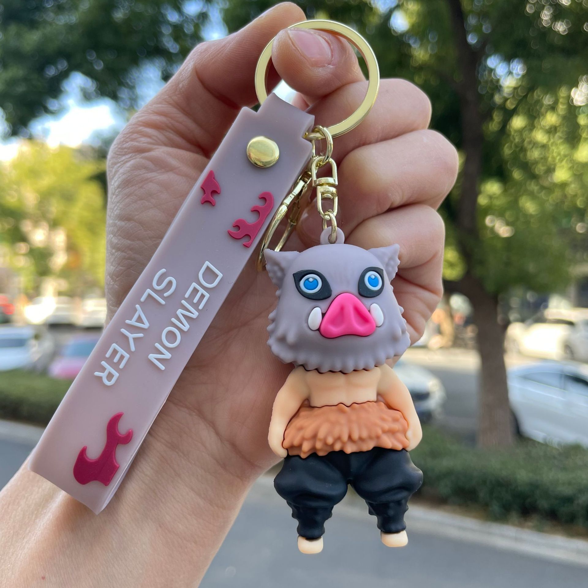 鬼滅の刃の鍵は自動車のキーチェーンの漫画の公仔のかばんのペンダントの子供機の小さい贈り物の卸売りを掛けます。