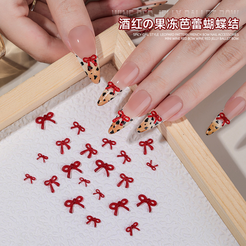 Hot Girl estampado leopardo arco francés joyas de resina de manicura vino rojo mini arco decoración de uñas al por mayor