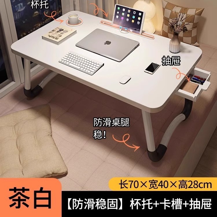 折り畳み可能なベッドの上の小さなテーブルは机のノートパソコンのテーブルを勉強します。|undefined