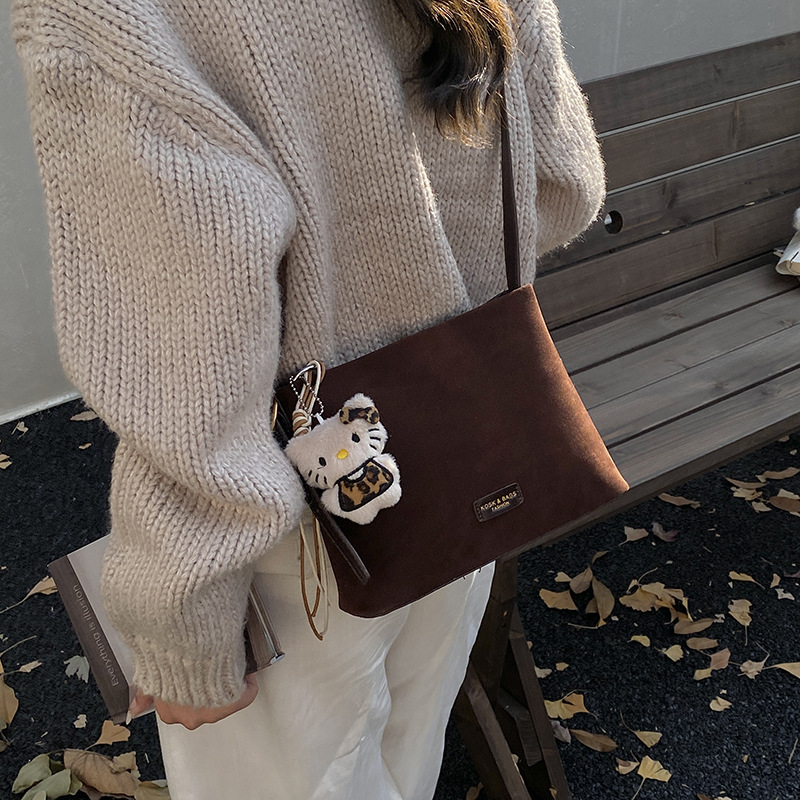 Otoño y invierno popular nicho bolso de brazo para mujeres 2025 nuevo bolso de cubo de gamuz estilo coreano retro bolso de hombro