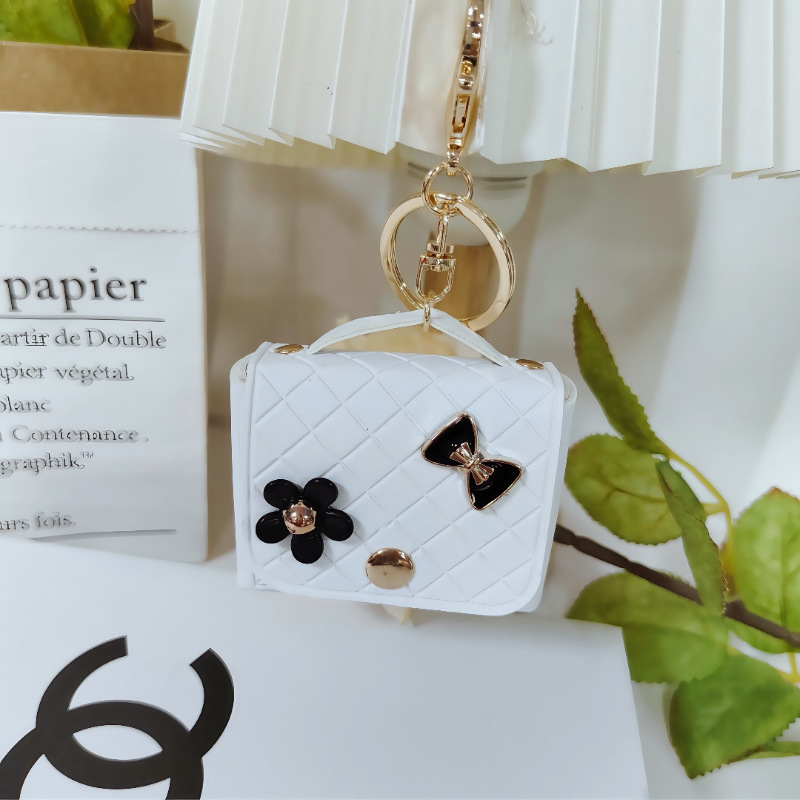 Nuevo estilo transfronterizo, moderno y exclusivo mini bolso acolchado tipo colgante, monedero para llaves, accesorio para auriculares.