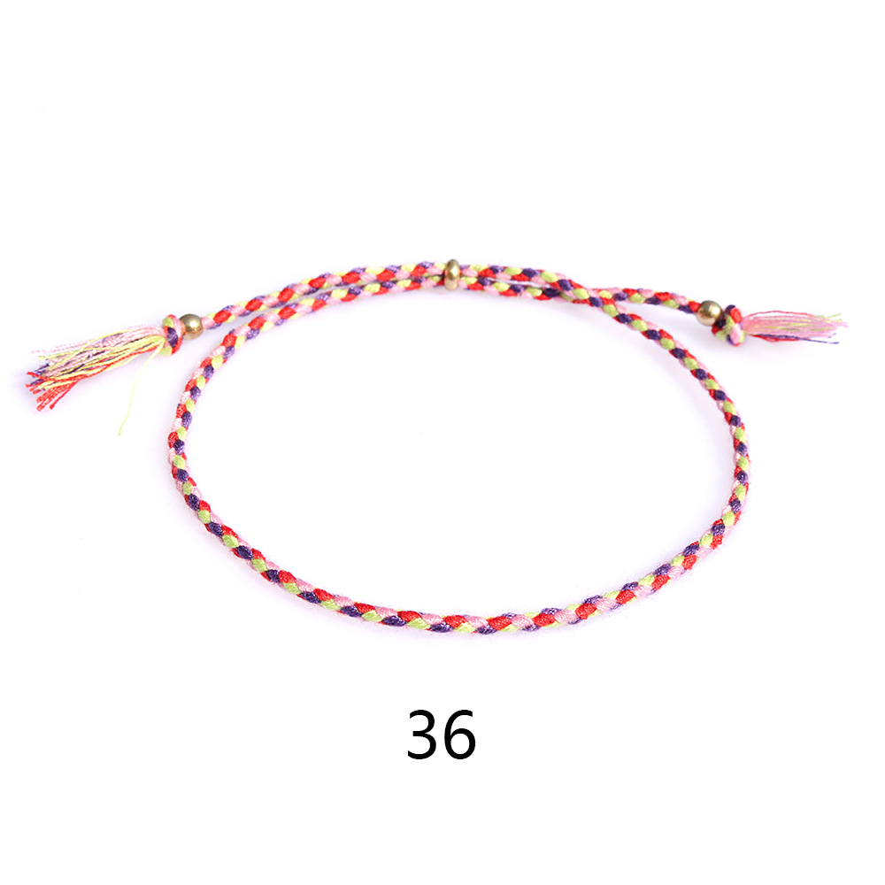 Amazon popular colorido cuerda de algodón amistad pulsera perlas de cobre borla pulsera tejida a mano ajustable hombres y mujeres pulsera