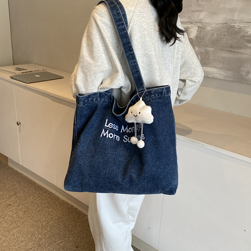 Bolsa de denim casual de gran capacidad para mujeres 2024 nueva bolsa de hombro de viaje, bolsa universitaria ligera y versátil