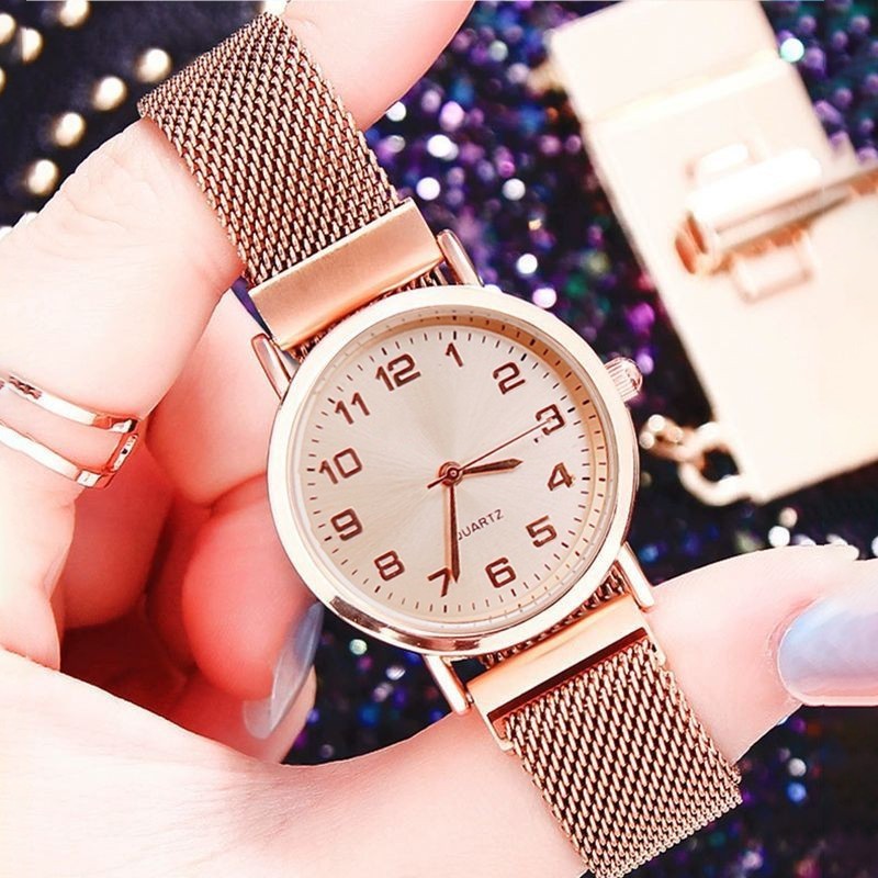 Rose gold band gold face