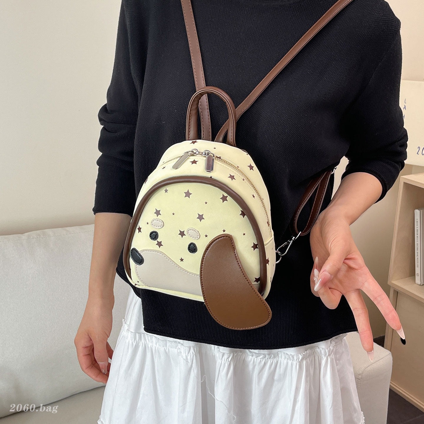 Estrellas de gran capacidad de dibujos animados temperamento perro nuevo diseño nicho mochila 2026 versión coreana de mujeres viajeros
