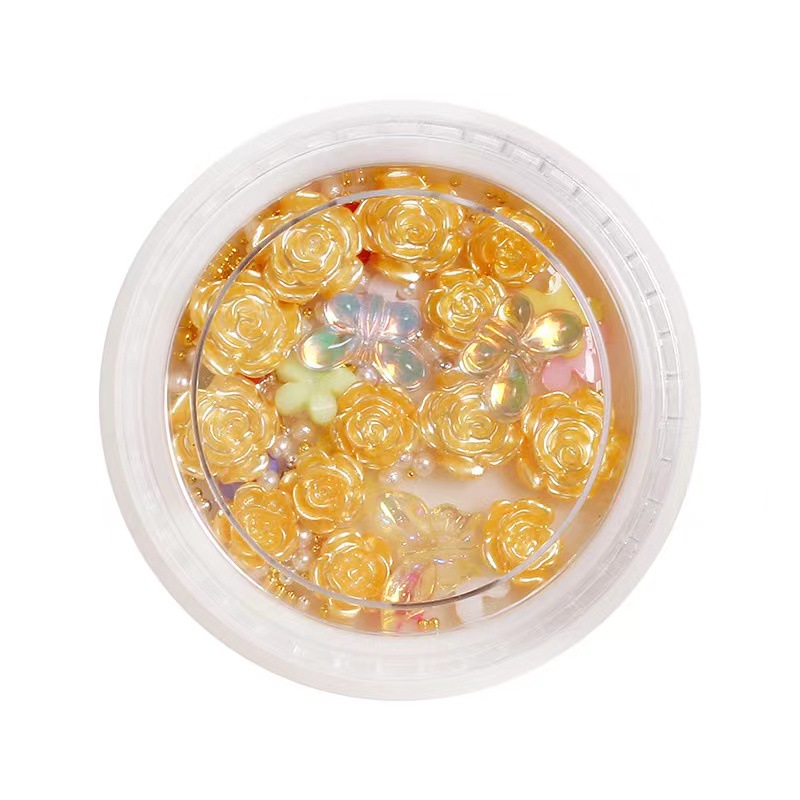 Nueva celebridad en línea suministros de uñas 3D multicolor de alto grado Camelia mariposa cinco pétalos flor bola de acero joyería de uñas diamante