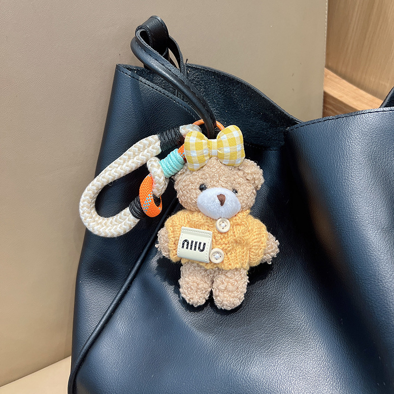 新商品のアニメの蝶結びのセーターの熊の車のキーホルダーのアイデアのぬいぐるみのカバンの装飾の女性