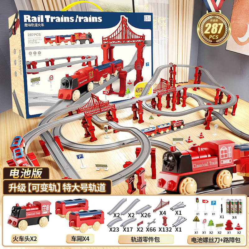 国境を越えた電気高速鉄道の電車は軌道を持っている男の女の子が模型を組んで車のおもちゃの誕生日プレゼントをシミュレートした