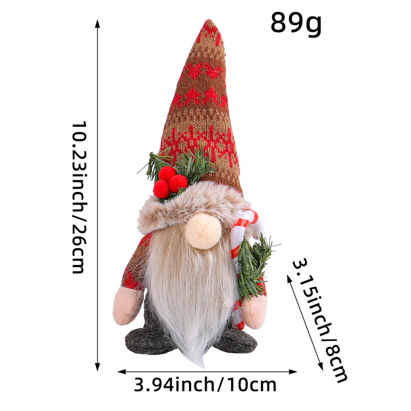 新しいクリスマスニットの雪の尖った帽子のぬいぐるみの置物のアイデアは松葉杖を抱いています。|undefined