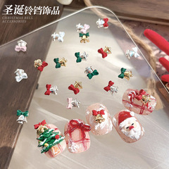 赤いクリスマスの鈴のネイルアクセサリーの蝶結びの黄金の銀色の合金の精巧で美しいです。