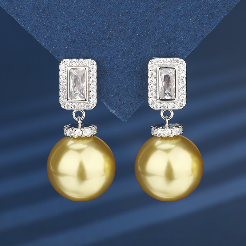 Otoño e invierno nuevo estilo Zhuang Shengsheng joyería fondo de cobre chapado en oro con incrustaciones de perlas de oro profundo borla traje premium femenino 16-14m