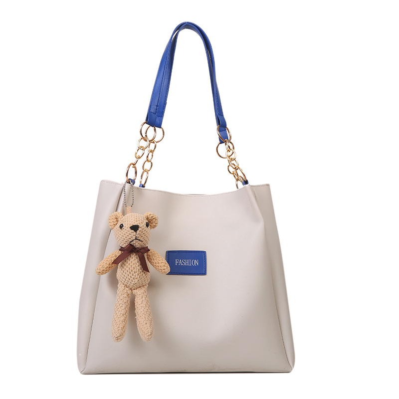 Bolsa de asas de gran capacidad de textura popular de este año para mujeres 2023 nueva moda casual estudiante bolsa de clase bolsa de cercanías