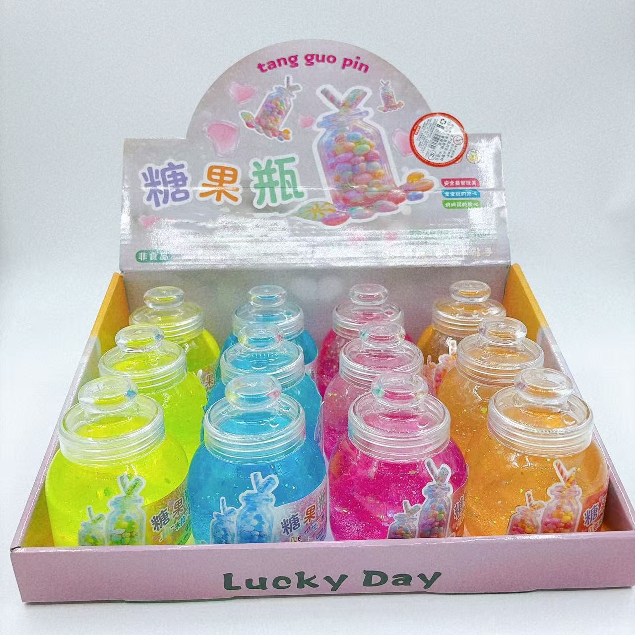 Botella de dulces de barro de cristal colorido botella de barro colorido juguetes para niños goma espumante slime barro transparente al por mayor