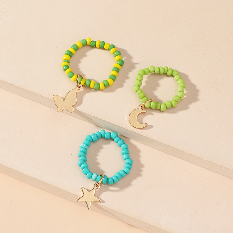 Simple Hand-woven Rice Bead Ring Fashion Temperament Butterfly Moon Star Pendant Elastic 3-piece Set display picture 3